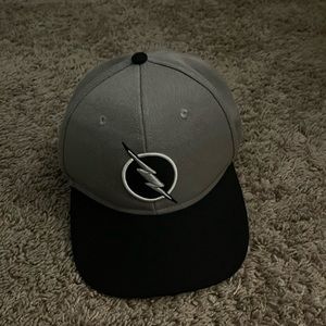 grey and black flash hat. Adjustable back